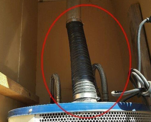 Here's some plastic being used on a hot water heat pipe. This is a serious danger for fire or carbon monoxide.